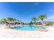 A community swimming pool with a slide and palm trees on a sunny day at 2132 Darlin Cir, Orlando, FL 32820