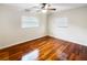 Well-lit bedroom with hardwood floors and two windows at 224 Alpine St, Altamonte Springs, FL 32701