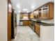Modern kitchen with wood cabinets, stainless steel appliances and granite countertops at 224 Alpine St, Altamonte Springs, FL 32701