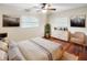 Large bedroom with hardwood floors, a dresser, and a ceiling fan at 224 Alpine St, Altamonte Springs, FL 32701