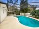 Inviting screened pool area with a spa and a spacious patio at 224 Alpine St, Altamonte Springs, FL 32701