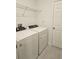 Laundry room with washer, dryer, and shelving at 224 Links Terrace Blvd, Daytona Beach, FL 32124