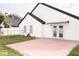 Home features a backyard patio and grassy lawn at 2319 Island Club Way, Orlando, FL 32822