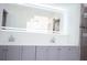 Bathroom featuring a built-in soaking tub and gray tile at 2319 Island Club Way, Orlando, FL 32822