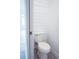 Clean bathroom with white toilet and modern wood-paneled walls at 2319 Island Club Way, Orlando, FL 32822