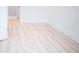 Bright bedroom with light wood laminate flooring and spacious closet at 2319 Island Club Way, Orlando, FL 32822