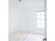 Simple bedroom with hardwood flooring and a large window at 2319 Island Club Way, Orlando, FL 32822