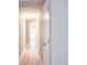 Light hallway with hardwood floors and white doors at 2319 Island Club Way, Orlando, FL 32822