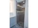 Modern shower with glass enclosure and gray tile at 2319 Island Club Way, Orlando, FL 32822