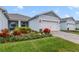 Gray house with double garage and landscaping at 3013 Cherry Blossom Loop, St Cloud, FL 34771