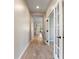 Bright hallway with tile floors and French doors at 3013 Cherry Blossom Loop, St Cloud, FL 34771