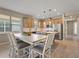 Spacious kitchen featuring light wood cabinets, stainless steel appliances, and an island at 3013 Cherry Blossom Loop, St Cloud, FL 34771