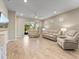 Spacious living area with access to a screened patio and neutral decor at 3013 Cherry Blossom Loop, St Cloud, FL 34771