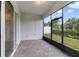 Screened patio with paver floor and backyard view at 3013 Cherry Blossom Loop, St Cloud, FL 34771