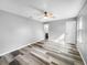 Bright bedroom with ceiling fan and laminate flooring at 3201 S Dorchester Dr, Deltona, FL 32738