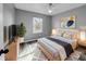 Cozy bedroom with light wood flooring and a large window at 3201 S Dorchester Dr, Deltona, FL 32738