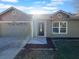 House front view with a two-car garage at 3201 S Dorchester Dr, Deltona, FL 32738