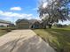 House exterior with a two-car garage and a well-manicured lawn at 3201 S Dorchester Dr, Deltona, FL 32738