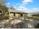 Back of house with sliding glass doors and a fenced backyard at 3201 S Dorchester Dr, Deltona, FL 32738