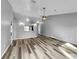 Open living room with high ceilings and laminate flooring at 3201 S Dorchester Dr, Deltona, FL 32738