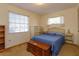 Simple bedroom with wood furniture and a window with curtains at 3817 Bainbridge Ave, Orlando, FL 32839