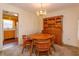 Bright dining area featuring a round table set and a wood hutch at 3817 Bainbridge Ave, Orlando, FL 32839