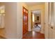Bright entryway with a wood door, tile flooring, and a view into the living room at 3817 Bainbridge Ave, Orlando, FL 32839