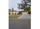 Ranch style home with a brick facade, attached garage, and well-maintained lawn at 3817 Bainbridge Ave, Orlando, FL 32839