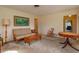 Spacious living room with a sofa, rocking chair, and a view of the backyard at 3817 Bainbridge Ave, Orlando, FL 32839