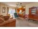 Living room with brown couch and an open view to the kitchen at 3817 Bainbridge Ave, Orlando, FL 32839