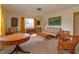 Cozy living room featuring mid-century furniture and large windows at 3817 Bainbridge Ave, Orlando, FL 32839