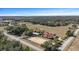 Aerial view of property with house, barn and riding arena at 4230 Rex Dr, Winter Garden, FL 34787