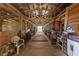 Spacious barn aisle with multiple stalls at 4230 Rex Dr, Winter Garden, FL 34787