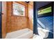 Bathroom with a shower/tub combo and brown tile surround at 4230 Rex Dr, Winter Garden, FL 34787