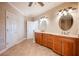 Elegant bathroom with double sinks and beige tile flooring at 4230 Rex Dr, Winter Garden, FL 34787