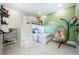 Playful bedroom with a bunk bed, hanging chair, and green accent wall at 4230 Rex Dr, Winter Garden, FL 34787