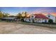 Home's exterior showcasing a barn and riding arena at 4230 Rex Dr, Winter Garden, FL 34787