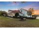 Two-story home with three-car garage and landscaping at 4230 Rex Dr, Winter Garden, FL 34787