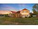 Home's rear view with screened porch and yard at 4230 Rex Dr, Winter Garden, FL 34787