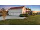 Three-car garage with attached screened porch at 4230 Rex Dr, Winter Garden, FL 34787