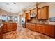Gourmet kitchen with granite counters and wood cabinets at 4230 Rex Dr, Winter Garden, FL 34787