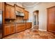 Kitchen with granite countertops and wood cabinets at 4230 Rex Dr, Winter Garden, FL 34787