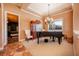 Music room with grand piano and display cabinet at 4230 Rex Dr, Winter Garden, FL 34787