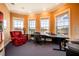Home office with built-in desk and window views at 4230 Rex Dr, Winter Garden, FL 34787