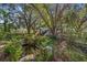 Charming play area nestled in a wooded setting with pond at 4230 Rex Dr, Winter Garden, FL 34787