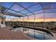 Enclosed pool and patio area with sunset view at 4230 Rex Dr, Winter Garden, FL 34787