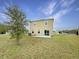 Private backyard with patio and grassy area at 4269 Desert Rose Ave, Kissimmee, FL 34746