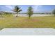 Spacious backyard with lake view and patio at 4269 Desert Rose Ave, Kissimmee, FL 34746