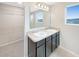 Bathroom with double vanity and walk-in shower at 4269 Desert Rose Ave, Kissimmee, FL 34746