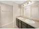 Bathroom with double vanity and granite countertop at 4269 Desert Rose Ave, Kissimmee, FL 34746